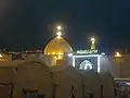 راه بازار به حرم، سردر عبارت «سلام بر تو ای برادر پیغمبر» به چشم می‌خورد