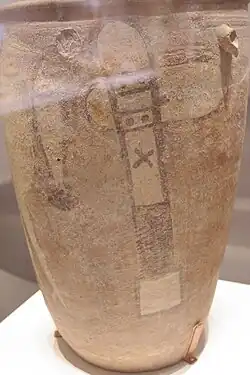 Painted pottery of neolithic Yangshao culture, with depiction of a stork catching a fish and a stone axe on the side
