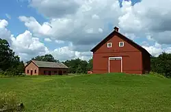 The remaining buildings of North Oaks Farm are preserved with the city.