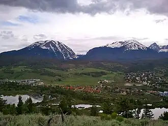 Silverthorne seen from a nearby mountain. In the background Buffalo Mountain is on the left, while Red Mountain and Mount Silverthorne are located adjacent to each other to the right.