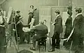 Christian Krohg (1852-1925), seated center, lecturing a class at Statens kunstakademi در اسلو.