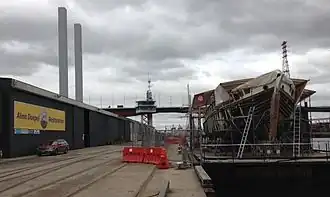 Alma Doepel on custom made barge undergoing hull work as part of complete restoration. Docklands, Victoria, Australia.