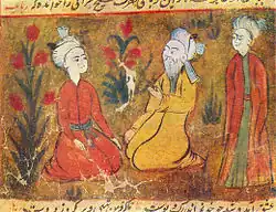 امیرخسرو توسط مردان جوان احاطه شده است.مینیاتوری از یک نسخه خطی مجلس العشاق سروده حسین بایقرا
