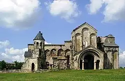 Ruins of a stone chuch with the highest point located at the apsis.