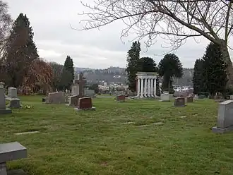 Calvary Cemetery in Ravenna/Bryant with دانشگاه واشینگتن residence towers in background.