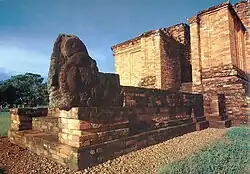 Entrance to a brown, squared temple.
