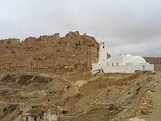 Ruined Berber village of Chenini, with its prominent مسجد. Photographed by Andy Carvin