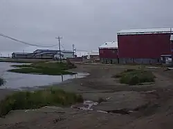 The school (blue), lake, and condemned old school (red).