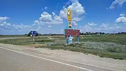 Welcome sign at the entrance to the selo of Chyorny Yar، the administrative center of Chernoyarsky District