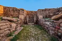 Archaeological site with some brick and stone walls