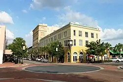 Intersection viewed diagonally with remodeled building on opposite corner
