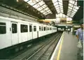 District line platforms in 1999. Note the crowded staircase behind the train.