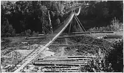 A footbridge at Angess over the Rogue River, circa 1927