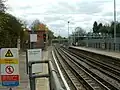 Looking south at southern end of station towards access to Hainault depot