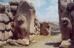 Stone gate with sculpted lions.