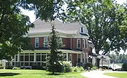Classic farmhouse along the south side of State Road 120 on the east side of Howe.