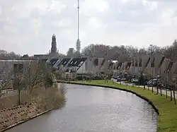 Hollandse IJssel through IJsselstein with church and برج گربراندی in background