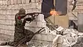 A fighter in position shooting, Tabqa