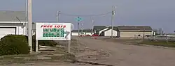Sign promoting Kenesaw Homestead Act at subdivision entrance