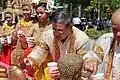 Elders cleanse statues of the Buddha with perfumed water in Cambodia
