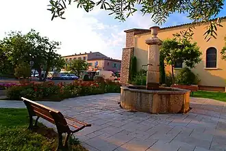 The old fountain in the square of the new village