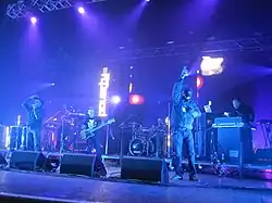 Leftfield playing live at Brixton Academy, London in December 2010. From left to right: Earl 16, Djum Djum, Neil Barnes, Sebastien Beresford, Cheshire Cat and Adam Wren.