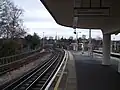 Looking south ("westbound") with siding visble on left (main group of sidings beyond the bend in the distance)