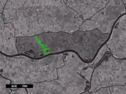 The town centre (red) and the statistical district (light green) of Tuil in the municipality of Neerijnen.
