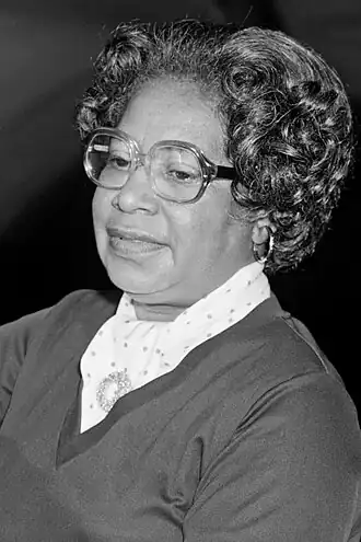 Mary Jackson sitting, adjusting a control on an instrument