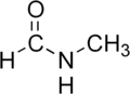 Skeletal formula of N-methylformamide with some implicit hydrogens shown, and one explicit hydrogen added
