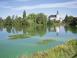 The pond with church