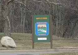 Welcome sign along northbound Okemos Road