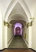 The staircase with the coat of arms of the Republic of Genoa.