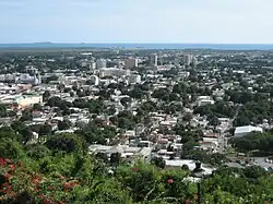 Ponce as seen from El Vigía, with the دریای کارائیب و Caja de Muertos in the background