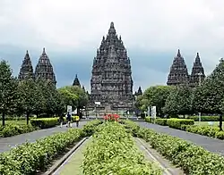 Symmetrically arranged stone bulidings. The steep roofs are decorated with a large number of small stupas.