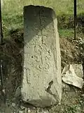 Khachkar monument beside the road leading to the village.