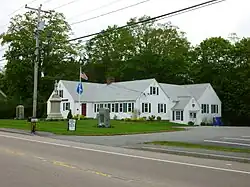 Raynham Public Library, with World War II, Civil War and World War I memorials on lawn