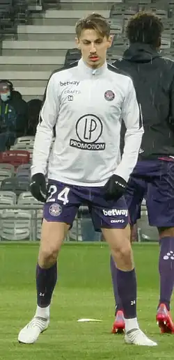 Bust of Anthony Rouault, dressed in Toulouse White training shirt
