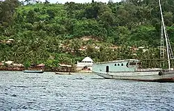 A maritime shore, with a hill bordering.