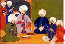 مجمع برای شاهنامهٔ سلیم خان با حضور دانشمندان، شمس الدین احمد قره باغی، سید لقمان، الیاس کاتب و نقاشان عثمان و علی (۱۵۷۱-۸۱)