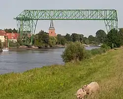 Osten Transporter Bridge over the Ostewith St. Peter's Church