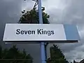 Sign on fast eastbound platform 2, with former "one" logo obscured by blue patch on the right