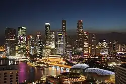 A view of the Downtown Core of Singapore, with the Esplanade in the foreground.