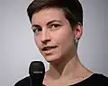 Keller at a microphone