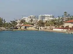 Surfside with buildings on Collins Ave in background