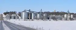 Tarnov seen from the east. In the foreground are grain bins along the Nebraska Central Railroad track; on the hill right of center is the steeple of St. Michael's Catholic Church.