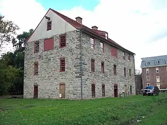 A three-story historic building in stone