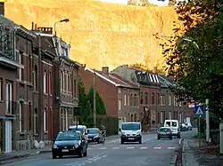 Trooz: main street,with the cliffs behind illuminated by the setting sun
