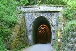 Western side of the old railway tunnel built in 1901, now converted to a bicycle route