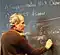  Edward Witten writing on a blackboard